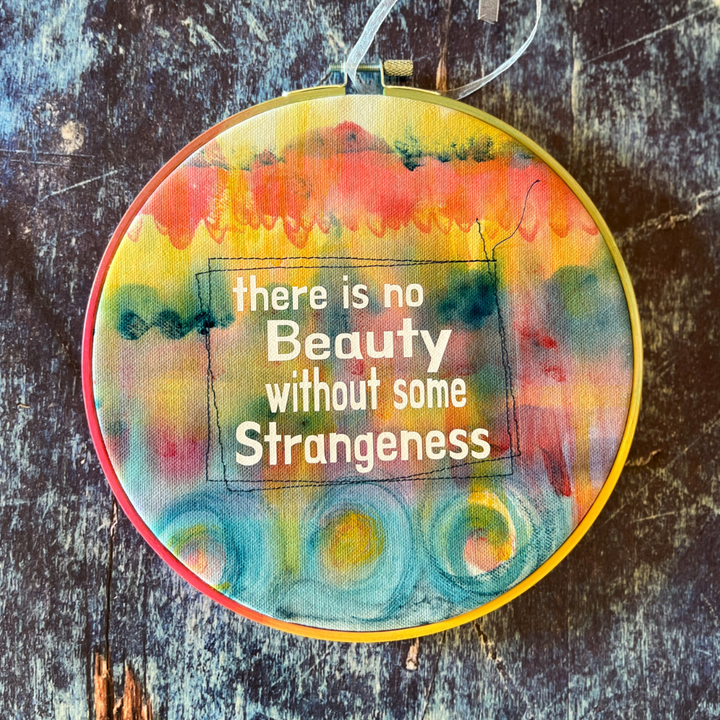 there is no beauty without some strange - painted mixed media hoop art