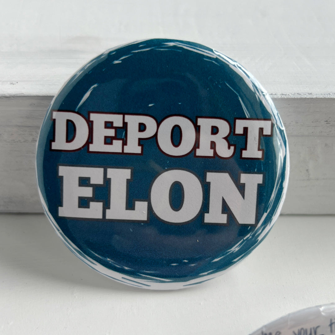 round pinback button with a blue background and the words, "Deport Elon" in white.