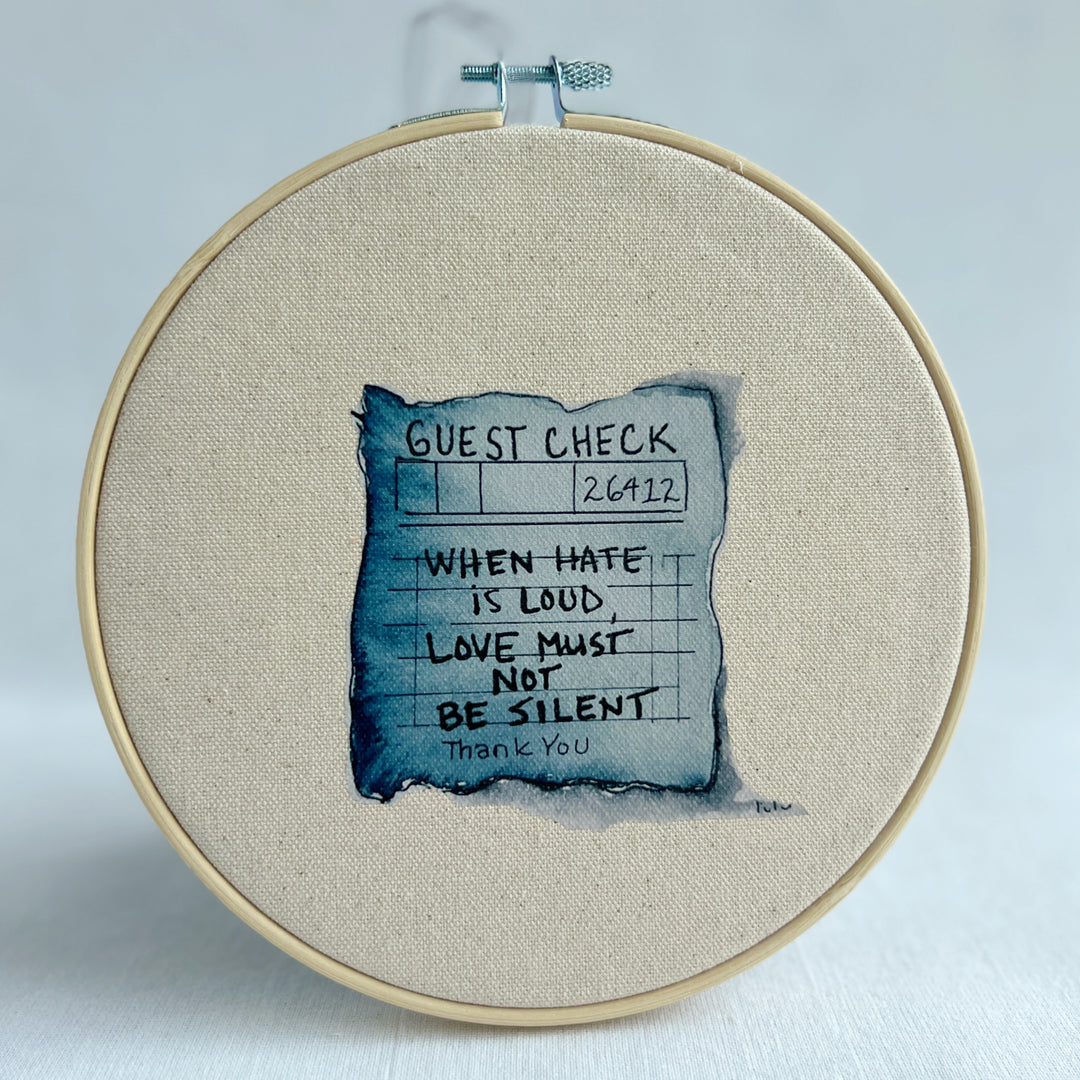 oatmeal linen canvas with a guest check design in deep blue-grey, with the words, when hate is loud, love must not be silent.