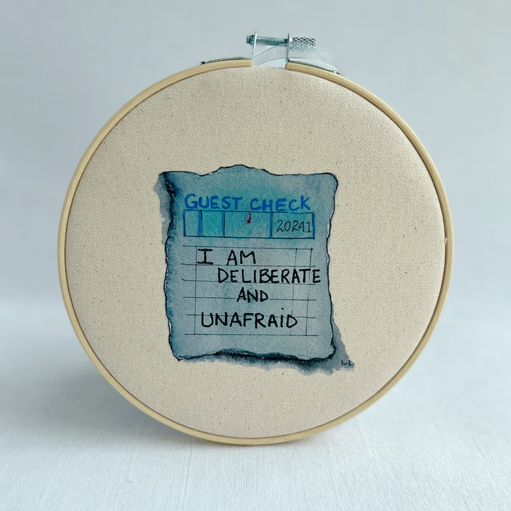 oatmeal linen canvas with a guest check design in deep blue-grey, with the words, when hate is loud, love must not be silent.