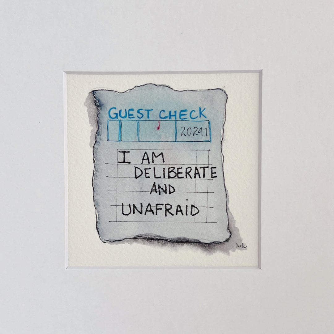 an original watercolor painting in shades of blue-grey, depicting a vintage crumpled diner guest check with the words,I am deliberate and unafraid, matted in white