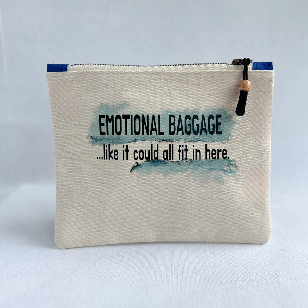 square canvas zip bag with the words, emotional baggage, like it could all fit in here. painted with swashes of blue