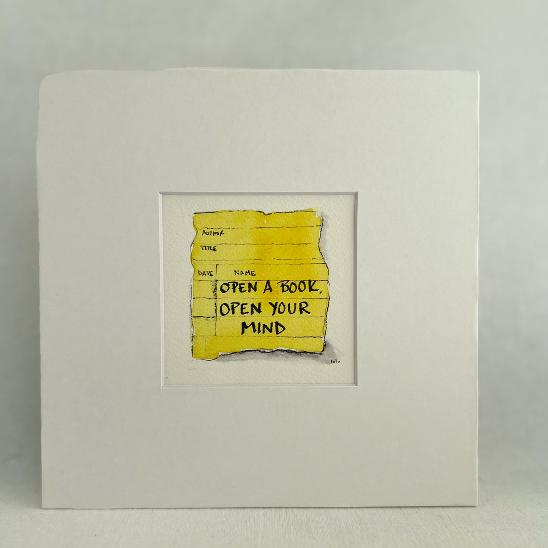 an original small watercolor painting depicting a torn vintage library checkout card in lemon yellow with the words, open a book open your mind matted in white