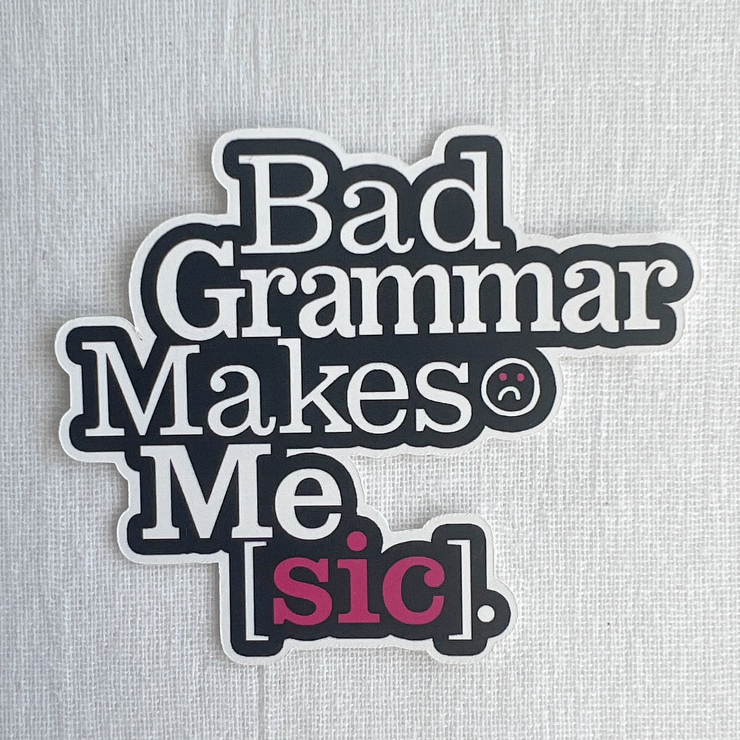 A word sticker with a black background and white lettering, with the words, "Bad grammar makes me [sic].