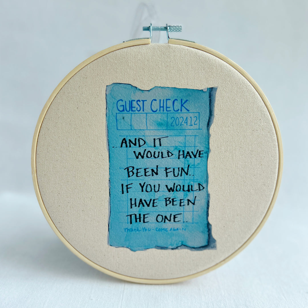 oatmeal linen canvas with a guest check design in deep blue, with the words, And it would have been fun, if you would have been the one. 