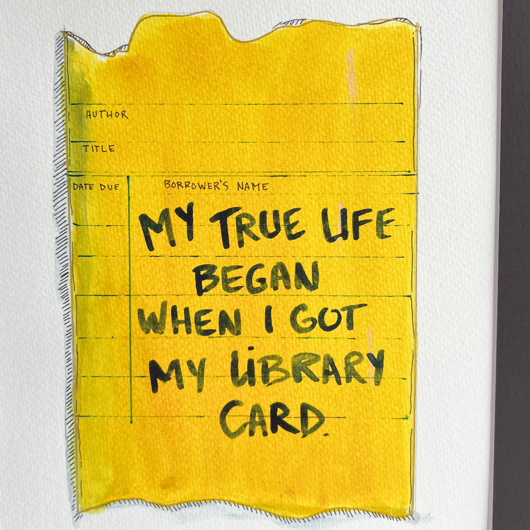 an original watercolor painting depicting a torn vintage library checkout card in shades of yellow with the words, my true life began when I got my library card, matted in black