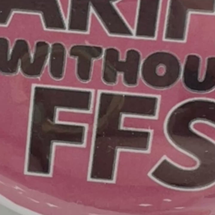 round pinback button with a pink background and the words, "you can't spell TARIFFS without FFS" in black lettering.